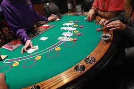 HD live-dealer studio broadcast showing professional blackjack table with multilingual dealer